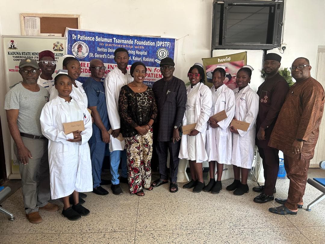 A foundation member interacting with community members during a Hope Project activity.